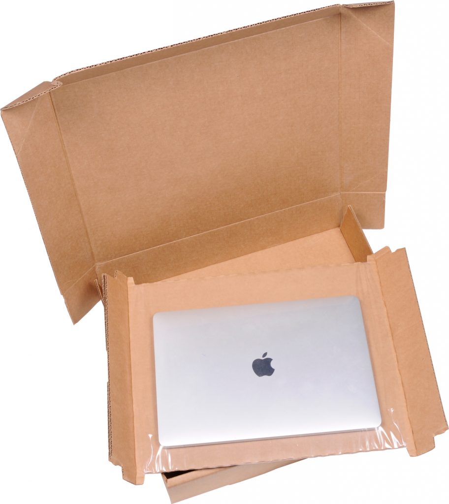 Laptop securely packaged in retention suspension packaging to prevent movement and damage during shipping.