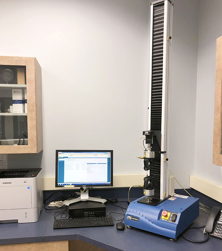 Haze meter testing equipment used to measure the clarity and optical properties of packaging materials.