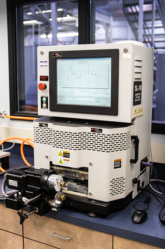 Hot Tack and Seal Initiation Temperature (SIT) testing equipment used to measure the sealing strength and temperature requirements of packaging materials.